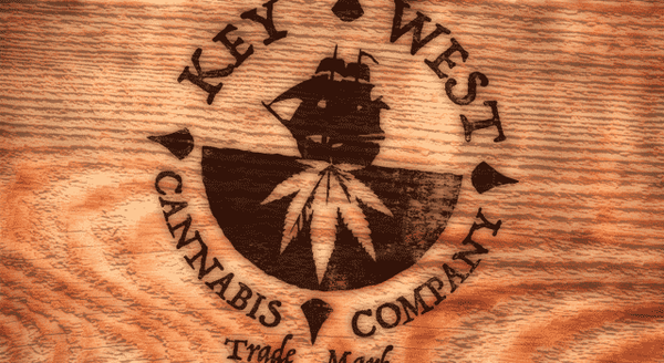 Key weat cannabis company logo branded on wood plank