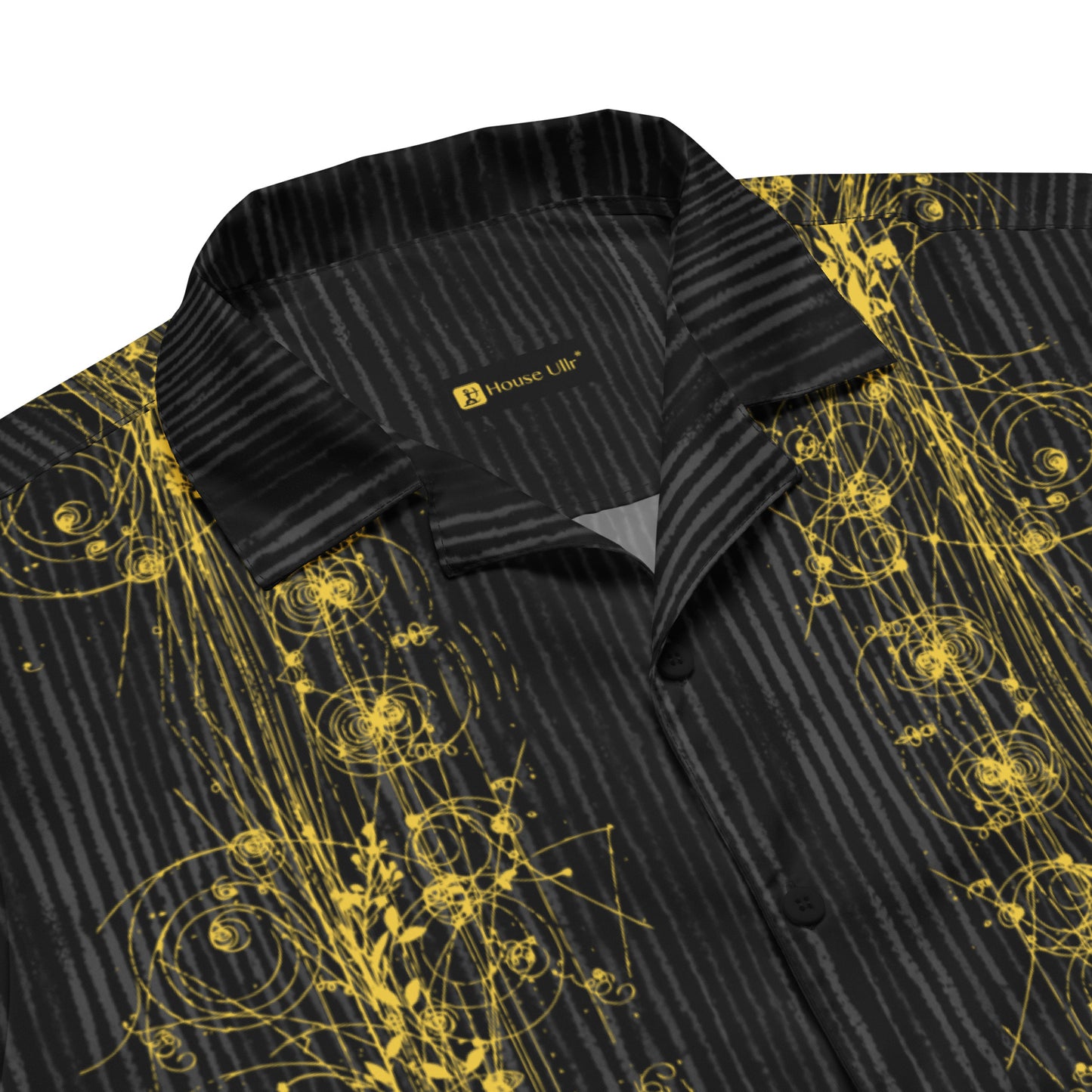 Close up of the Anura Theta Button Shirt showing the gold particle energy design. and collar detail.