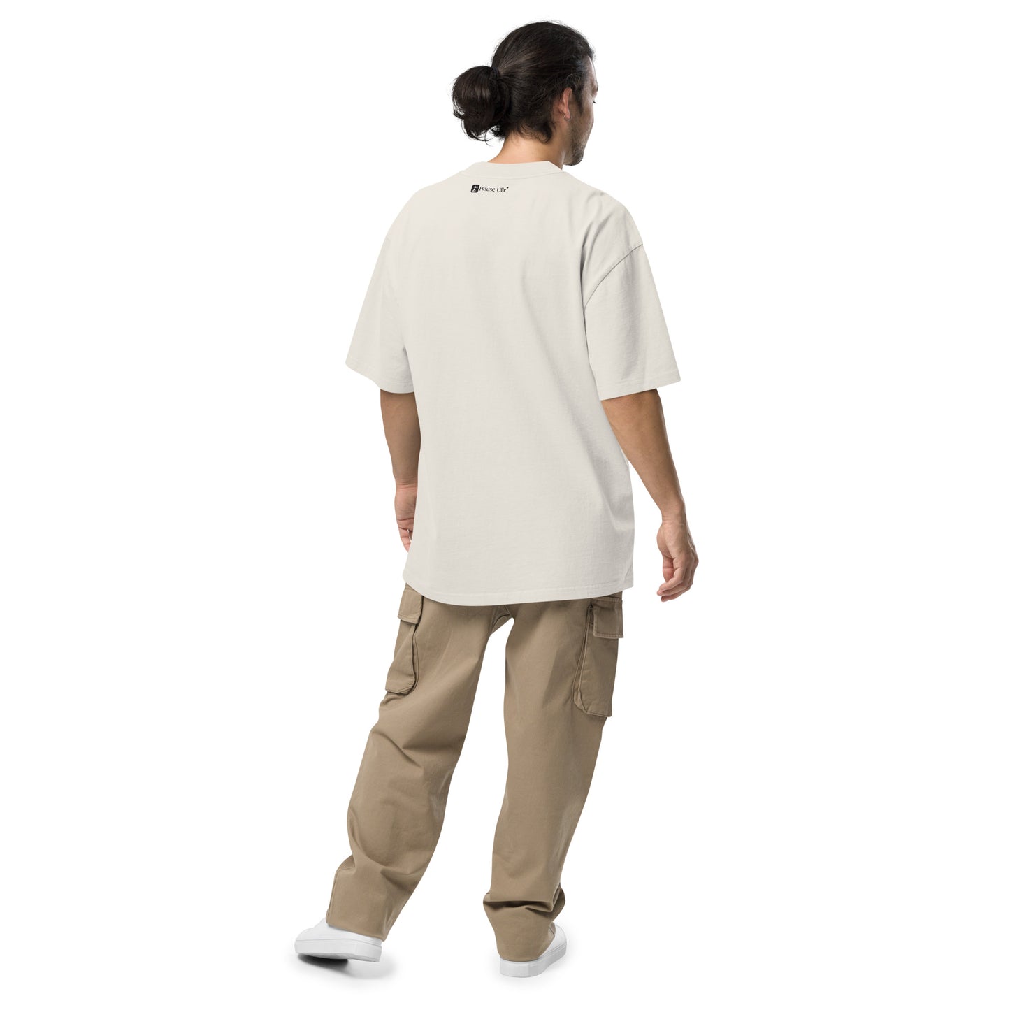 Dude Modeling the Birds of Peace Oversize T-shirt from the back in faded bone color.