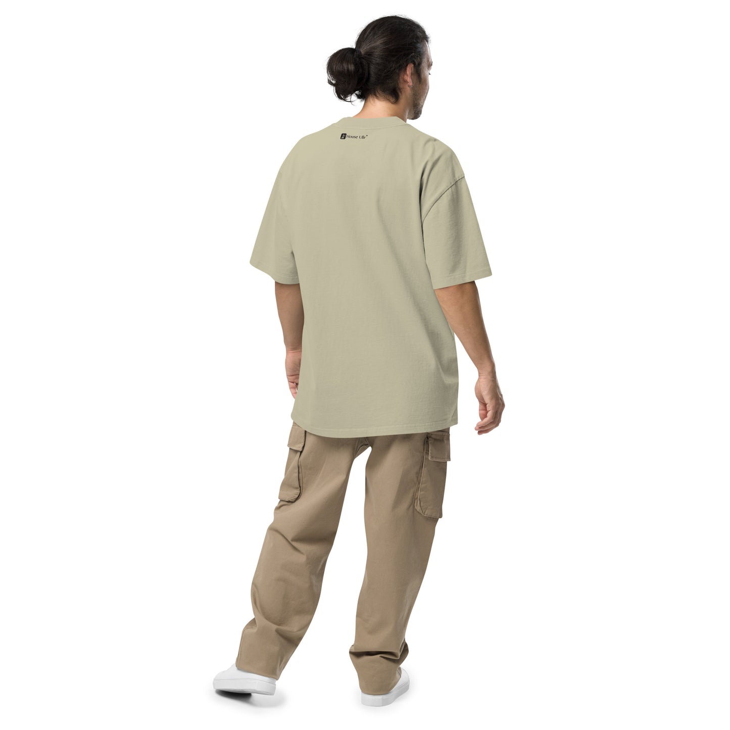 Dude Modeling the Birds of Peace Oversize T-shirt from the back in faded eucalyptus color.