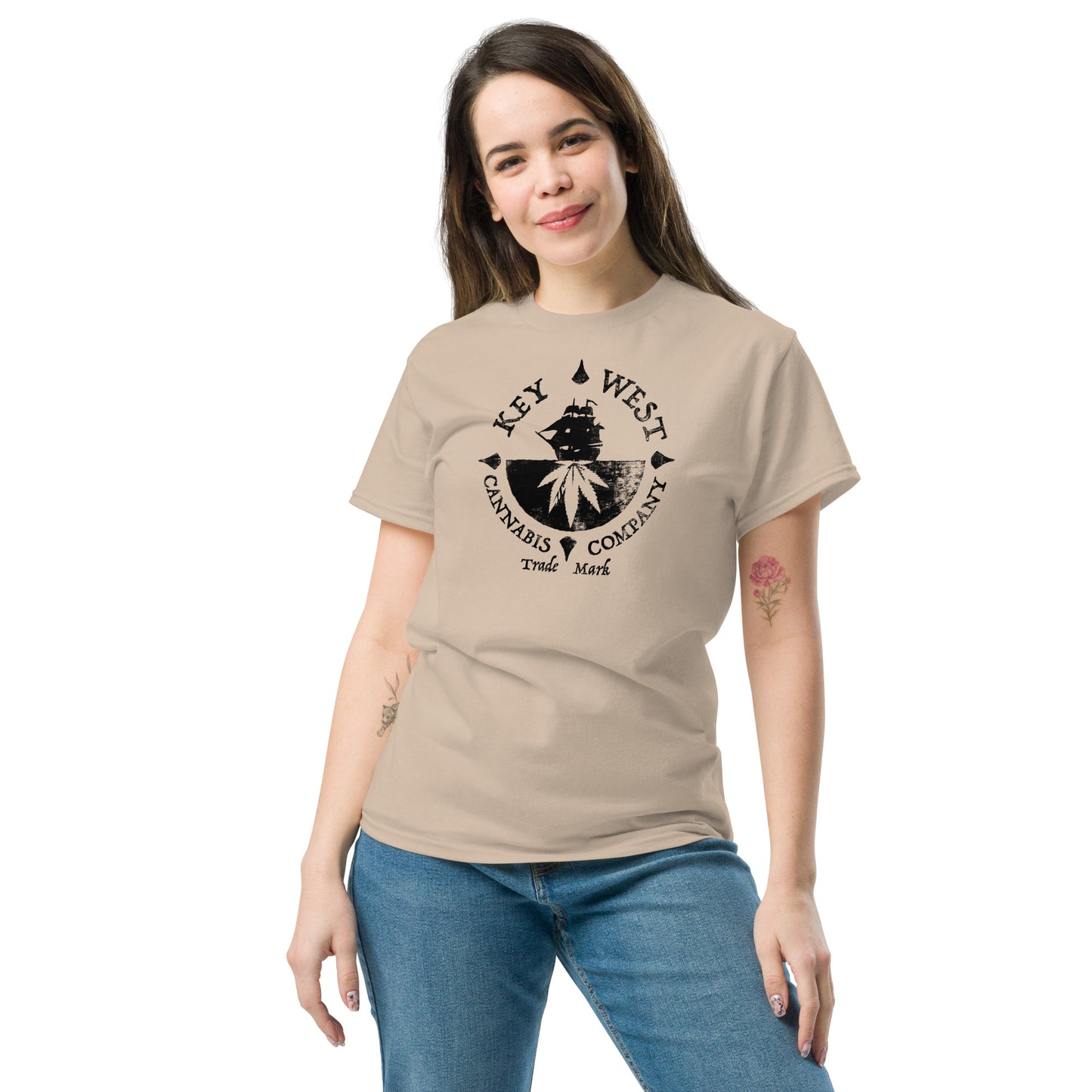 Woman modeling the Key West Cannabis Company Brand graphic in black on a Sand Color T-shirt from the front.